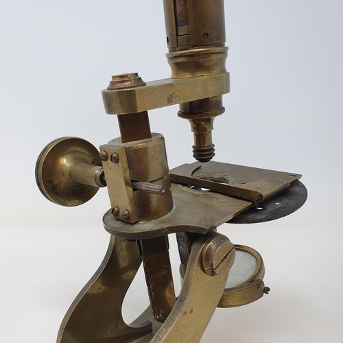 586 - A student's brass microscope, 33 cm high