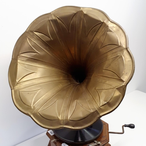 592 - An Amplifier gramophone, with a brass horn, 46 cm diameter