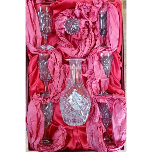 659 - A Tudor crystal decanter set, boxed, assorted books, a footstool, and various miscellanea (10 boxes)