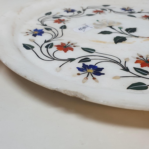 678 - An Agra plaque, decorated flowers, 31 cm diameter