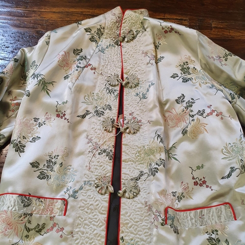 711 - A modern Chinese silk jacket, decorated lotus blossoms