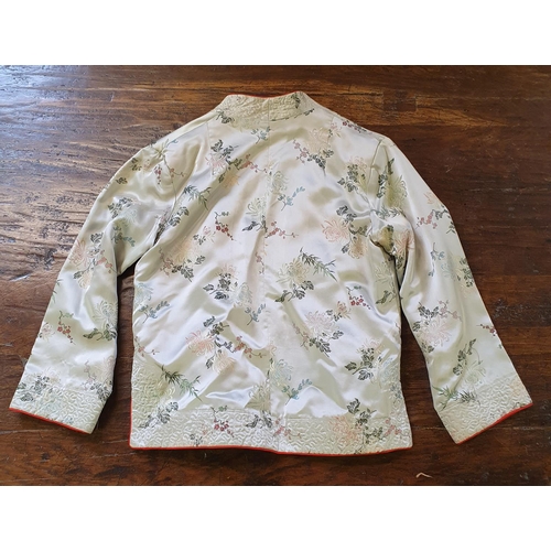 711 - A modern Chinese silk jacket, decorated lotus blossoms