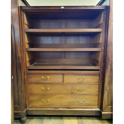 729 - A 19th century mahogany wardrobe, the centre section with two cupboard doors, to reveal slides, two ... 