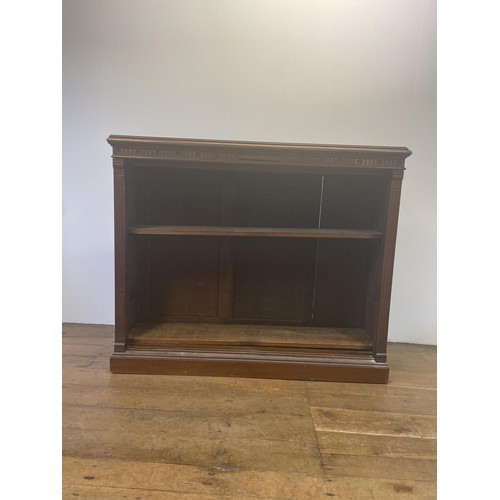 737 - A mahogany bookcase, with two adjustable shelves, 117 cm high x 140 cm wide