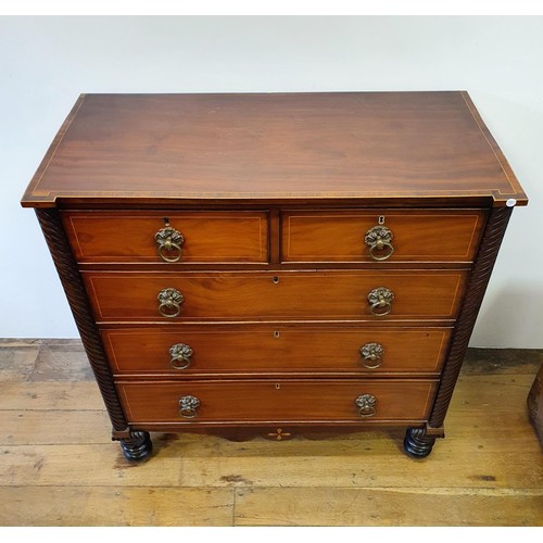 738 - A Channel Islands mahogany chest, having two short and three long drawers, flanked by spiral turned ... 