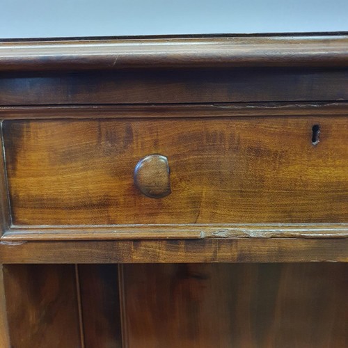 740 - A mahogany kneehole desk, having a seven drawer configuration, with a cupboard door to kneehole, 124... 