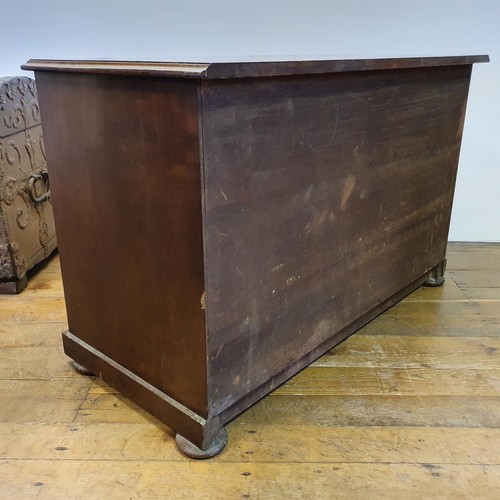 740 - A mahogany kneehole desk, having a seven drawer configuration, with a cupboard door to kneehole, 124... 