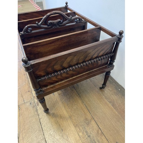 762 - A 19th century mahogany Canterbury, with a scrolled handle, with turned supports and tapering legs t... 