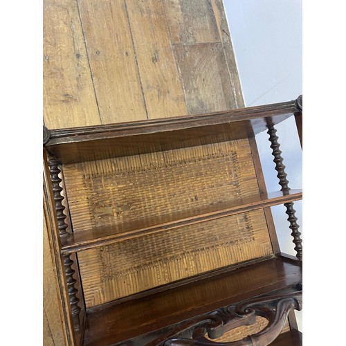 762 - A 19th century mahogany Canterbury, with a scrolled handle, with turned supports and tapering legs t... 