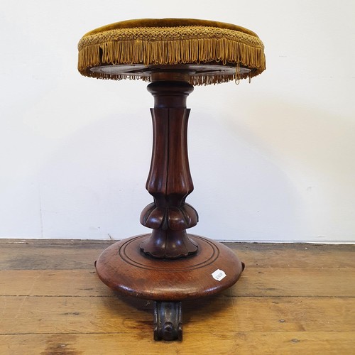 768 - A 19th century mahogany piano stool