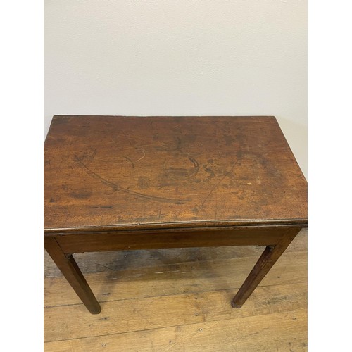 777 - A 19th century mahogany folding tea table, on square chamfered legs, 73 cm high, 68 cm wide