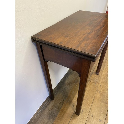 777 - A 19th century mahogany folding tea table, on square chamfered legs, 73 cm high, 68 cm wide