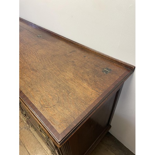 781 - An oak mule chest, with a hinged top, above six faux drawers and three real drawers, 169 cm wide