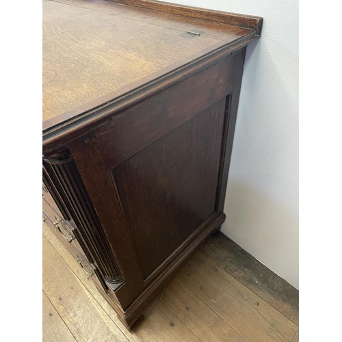 781 - An oak mule chest, with a hinged top, above six faux drawers and three real drawers, 169 cm wide