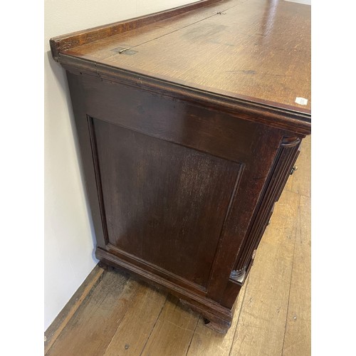 781 - An oak mule chest, with a hinged top, above six faux drawers and three real drawers, 169 cm wide