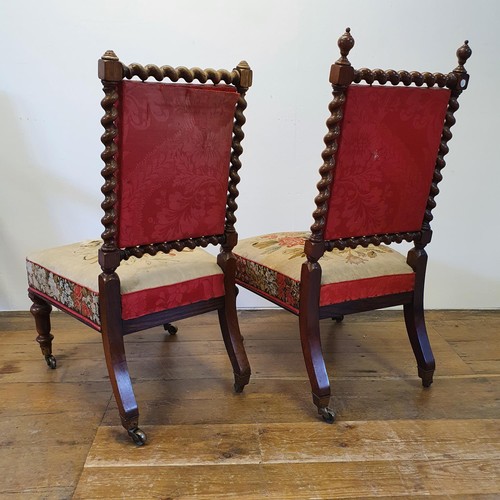 784 - A pair of 19th century rosewood framed nursing chairs, with embroidered backs and seats (2)