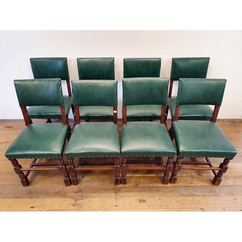 787 - A set of eight oak dining chairs, with padded backs and seats (8)