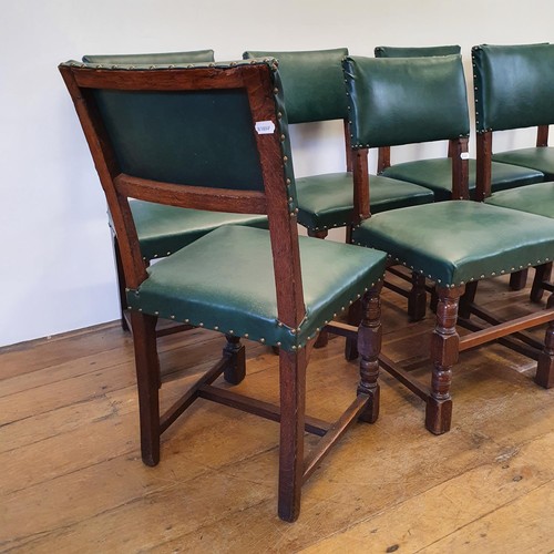 787 - A set of eight oak dining chairs, with padded backs and seats (8)