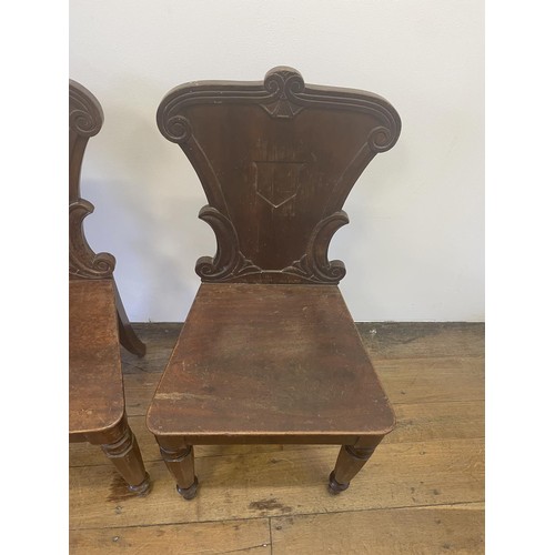 793 - A pair of 19th century mahogany hall chairs (2)