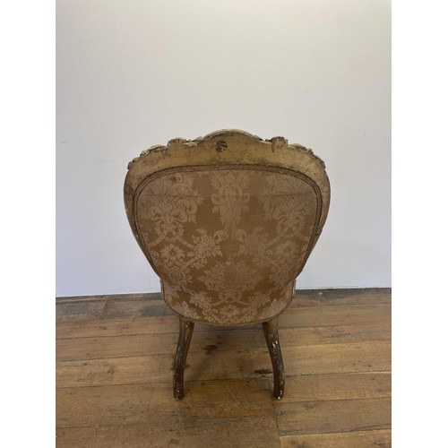 796 - A 19th century gilt framed button back nursing chair