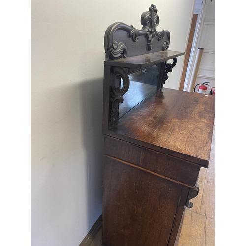 802 - A 19th century rosewood chiffonier, with a raised mirrored back, the base having a drawer and two cu... 