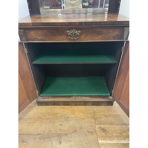 802 - A 19th century rosewood chiffonier, with a raised mirrored back, the base having a drawer and two cu... 