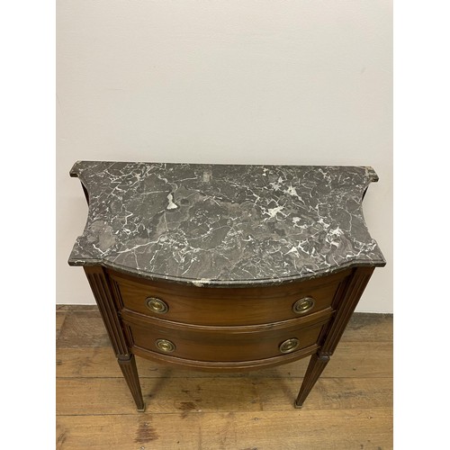 803 - A French marble topped commode, having three drawers, on square tapering legs, 64 cm wide