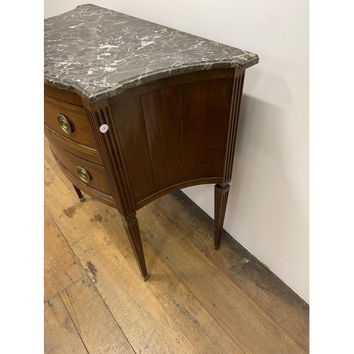 803 - A French marble topped commode, having three drawers, on square tapering legs, 64 cm wide