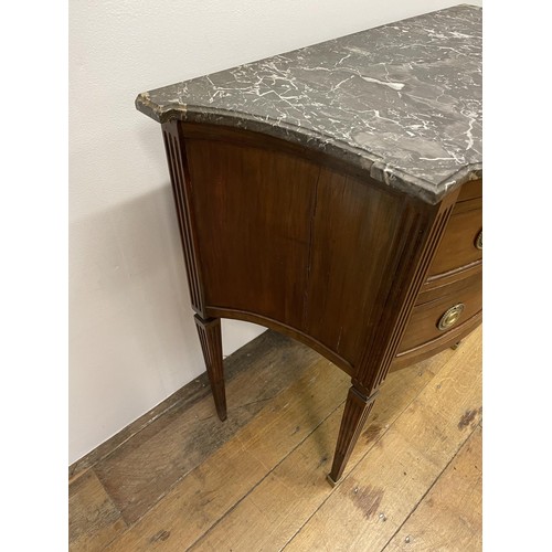 803 - A French marble topped commode, having three drawers, on square tapering legs, 64 cm wide