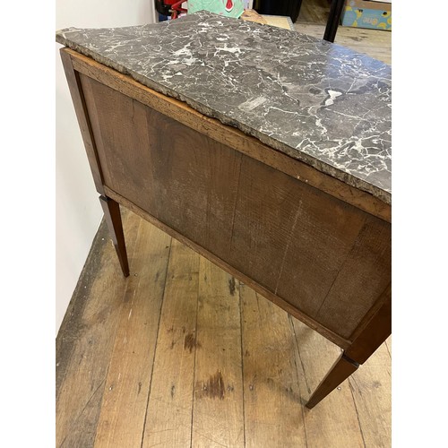 803 - A French marble topped commode, having three drawers, on square tapering legs, 64 cm wide