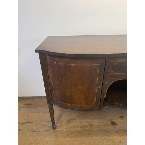 820 - A mahogany sideboard, with a single drawer, flanked by two cupboard doors, on turned reeded legs, 18... 