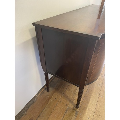 820 - A mahogany sideboard, with a single drawer, flanked by two cupboard doors, on turned reeded legs, 18... 