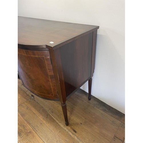 820 - A mahogany sideboard, with a single drawer, flanked by two cupboard doors, on turned reeded legs, 18... 