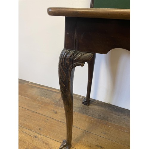 834 - A 19th century mahogany folding card table, on carved cabriole legs to ball and claw feet, 97 cm wid... 