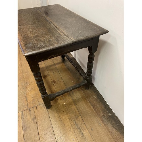 835 - An 18th century oak side table, with a single frieze drawer, on bobbin turned legs, 54 cm wide