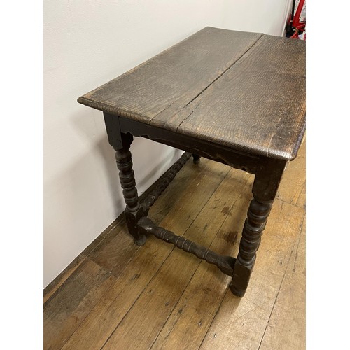 835 - An 18th century oak side table, with a single frieze drawer, on bobbin turned legs, 54 cm wide