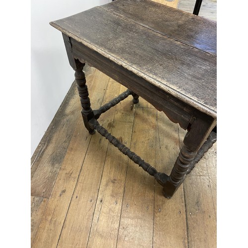 835 - An 18th century oak side table, with a single frieze drawer, on bobbin turned legs, 54 cm wide