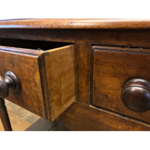 783 - An oak dresser, having a later two tier plate rack above a base with three frieze drawers and a potb... 