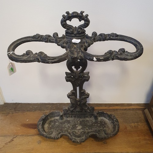 771 - A cast iron stick stand, 64 cm high