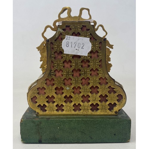 357 - A 19th century mantel clock, the 6 cm diamete enamel dial with Arabic numerals, in a gilt metal case... 