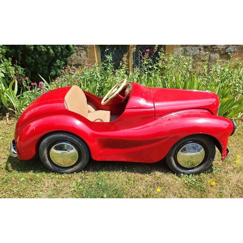 65 - An Austin J40 childs red painted pedal car, numbered 28052 on the boot floor