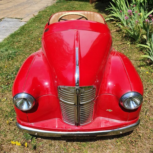 65 - An Austin J40 childs red painted pedal car, numbered 28052 on the boot floor