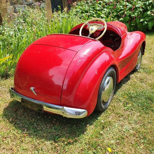 65 - An Austin J40 childs red painted pedal car, numbered 28052 on the boot floor