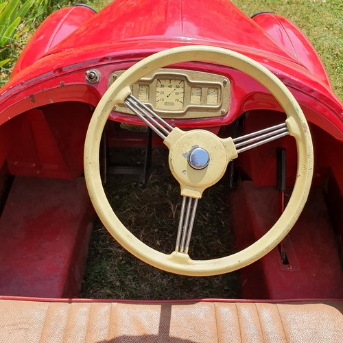 65 - An Austin J40 childs red painted pedal car, numbered 28052 on the boot floor