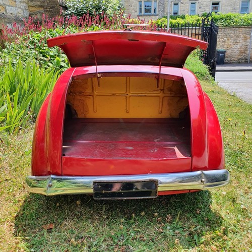 65 - An Austin J40 childs red painted pedal car, numbered 28052 on the boot floor