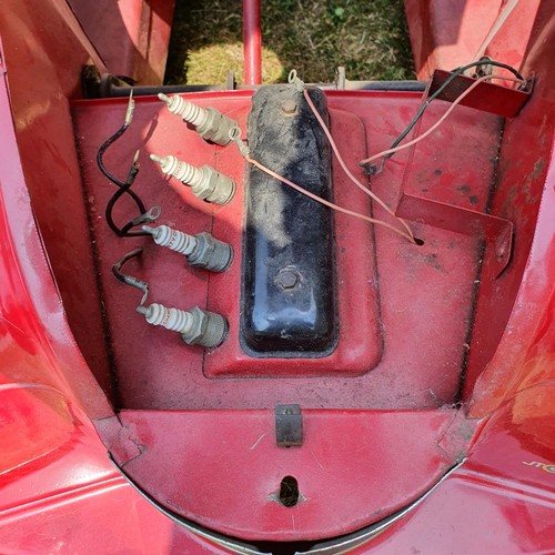 65 - An Austin J40 childs red painted pedal car, numbered 28052 on the boot floor