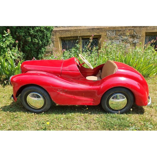 65 - An Austin J40 childs red painted pedal car, numbered 28052 on the boot floor