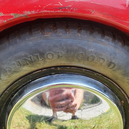 65 - An Austin J40 childs red painted pedal car, numbered 28052 on the boot floor