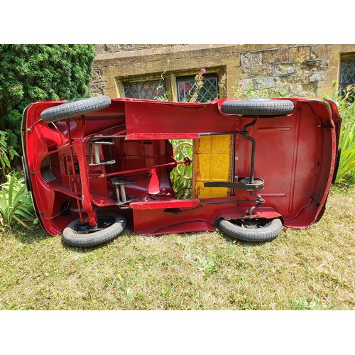 65 - An Austin J40 childs red painted pedal car, numbered 28052 on the boot floor