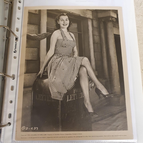 27 - An album of 1930s and 1950s film portrait photographs, and lobby cards, to include Joan Marion, Andr... 